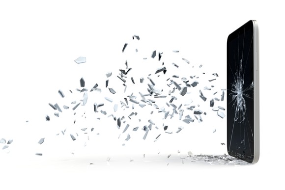 Broken glass shards fly from a shattered smartphone screen