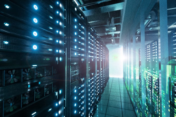 An aisle of server racks in a datacenter