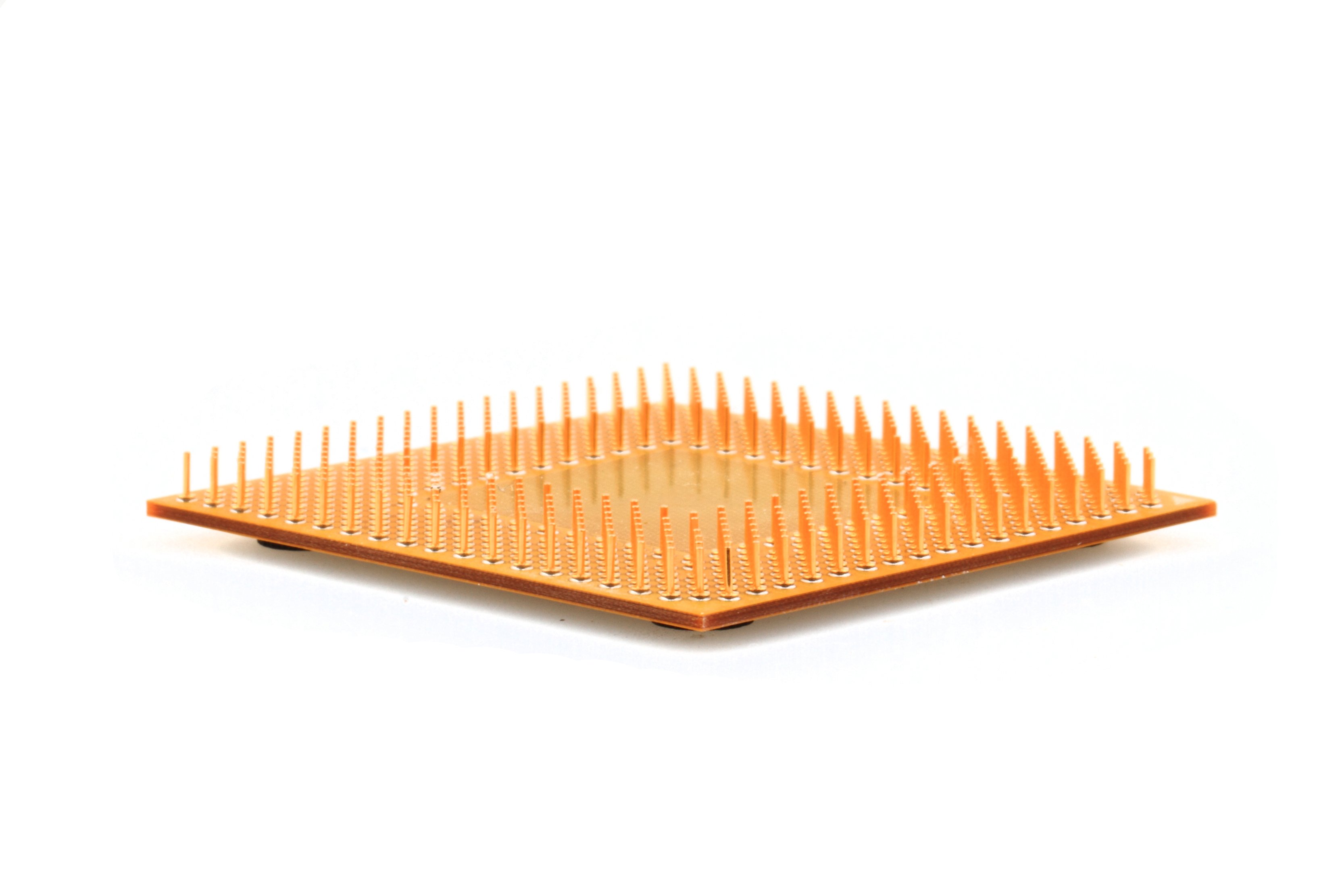 Gold-colored microprocessor on a white background