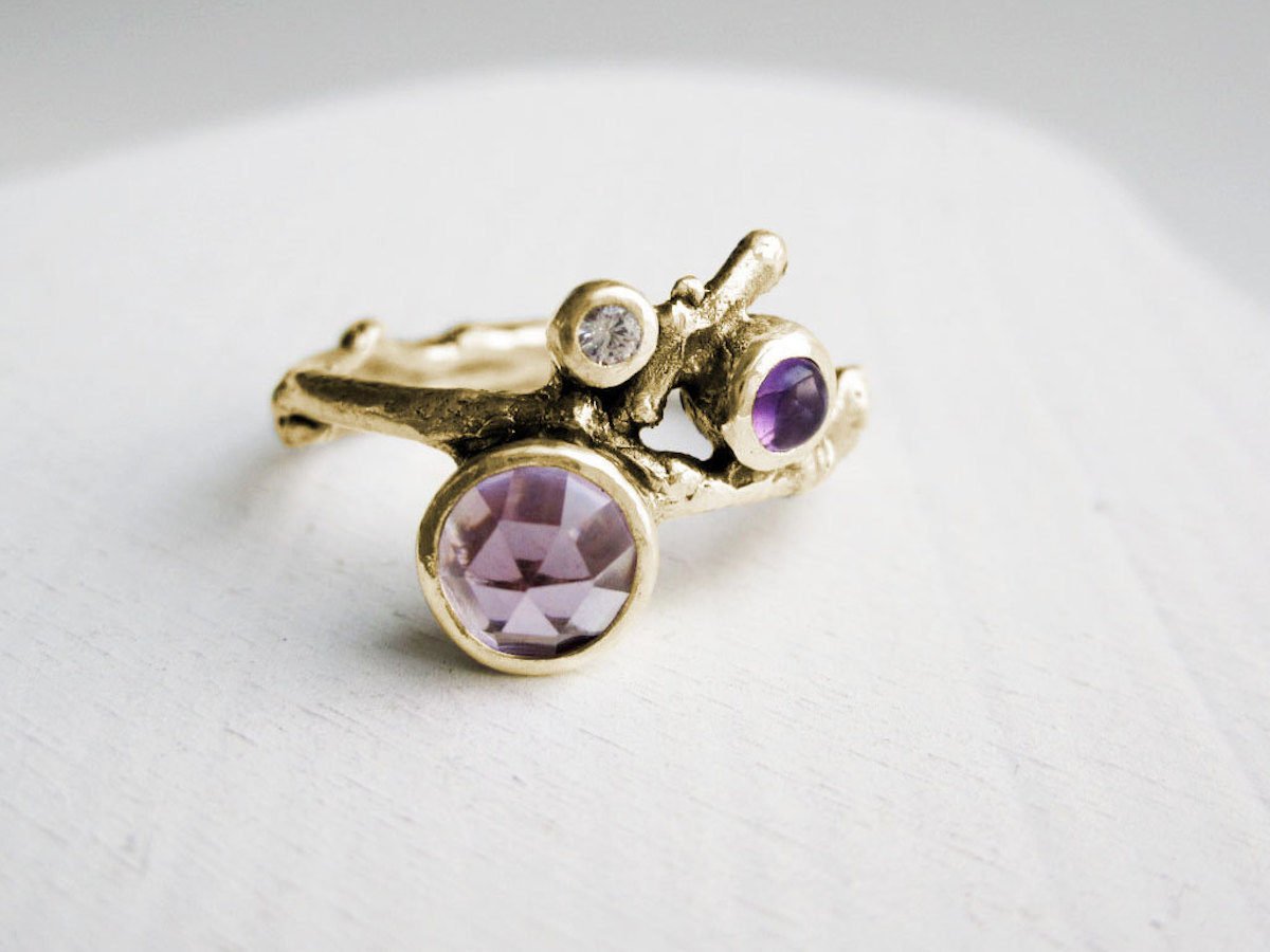 An amethyst ring on a white background.