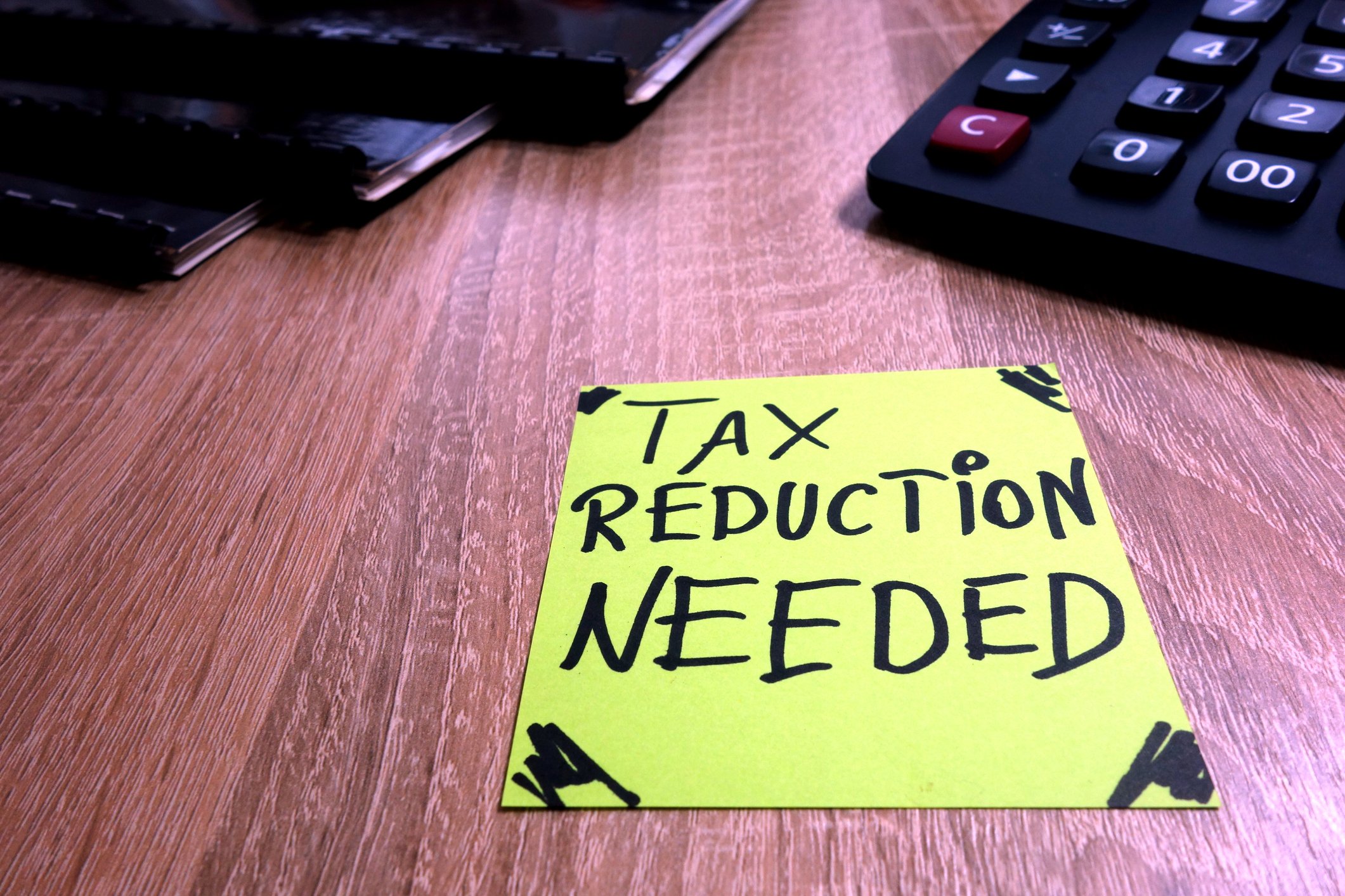Post-it note reading tax reduction needed