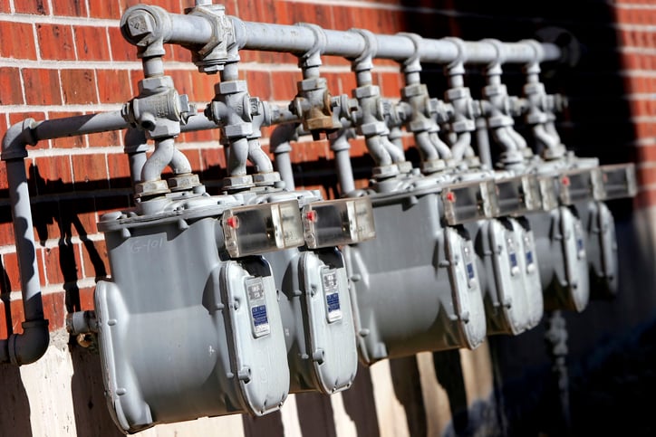 Natural gas meters outside of a building.