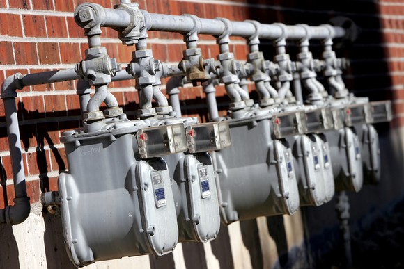 Natural gas meters outside of a building.