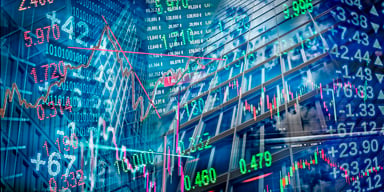 Several stock market charts and symbols.