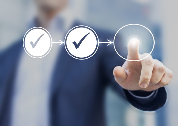 A person checking virtual check boxes.