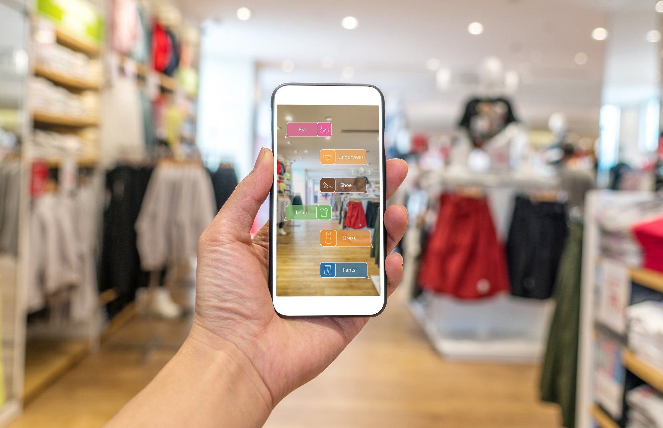 A shoppers uses an AR app in a store.