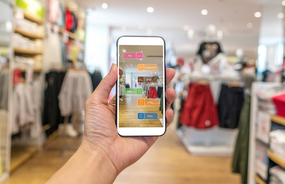 A shoppers uses an AR app in a store.