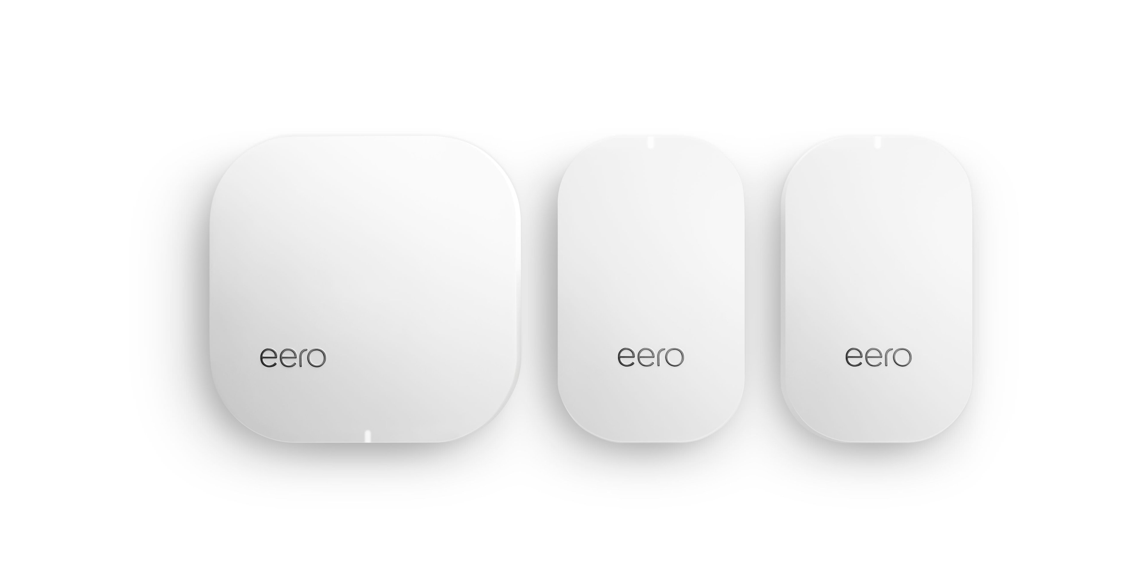 Three eero home networking devices.