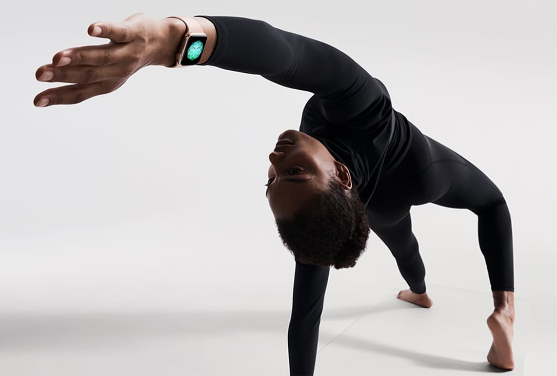 Person stretching while wearing Apple Watch Series 4