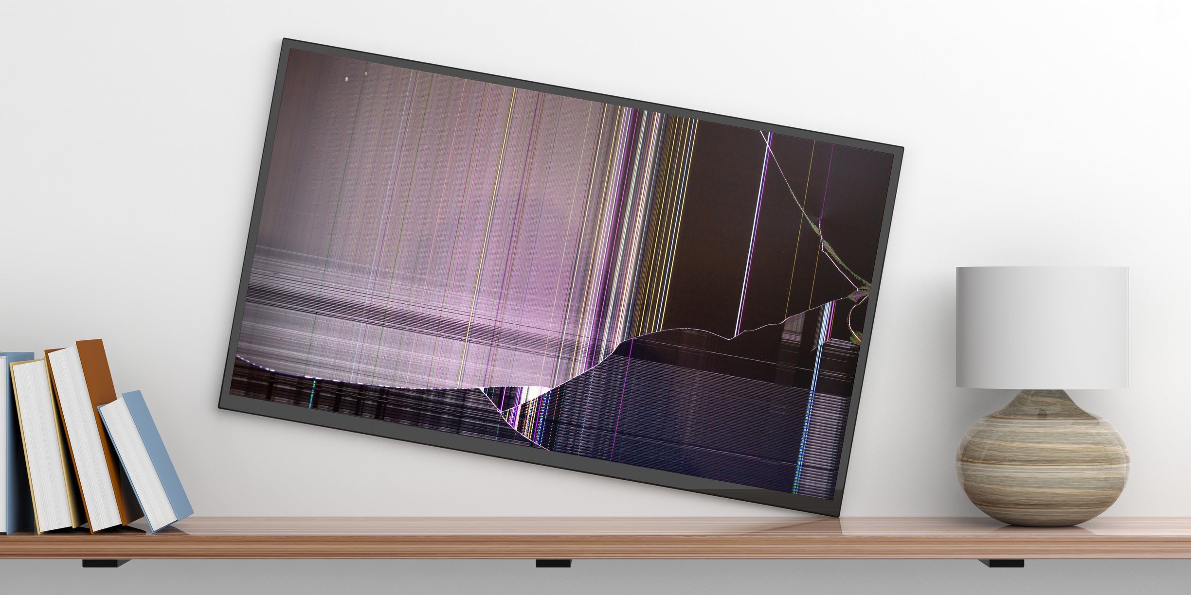 Image of a TV falling off of a wall.