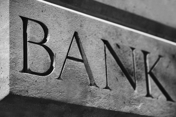 Word "bank" carved into stone.