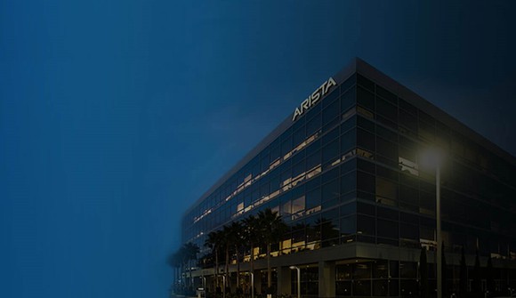 Building with Arista name on the side at dusk