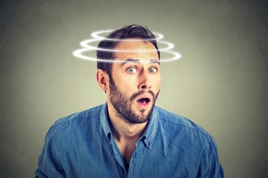 Surprised man with head spinning