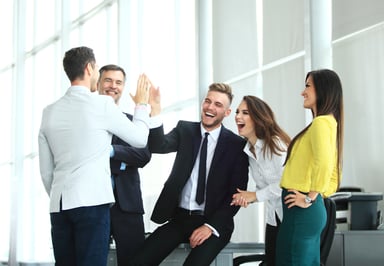 coworkers celebrating_GettyImages-909286378