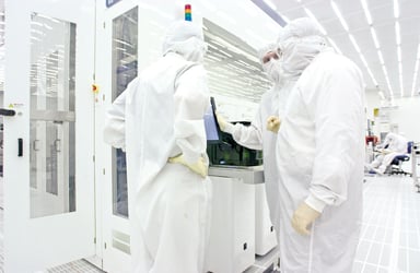 Guys in white protective suits applied materials