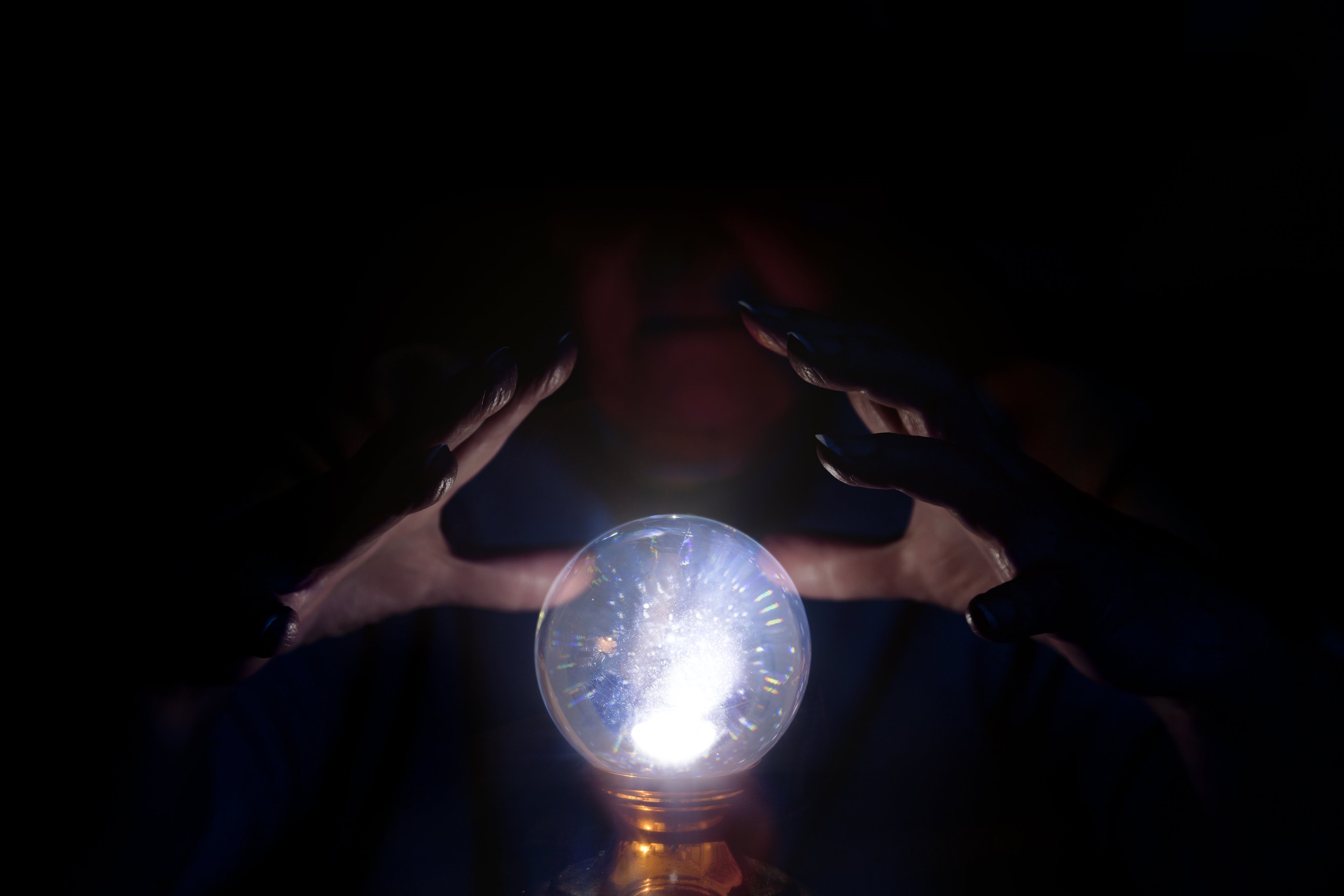 An image of a psychic peering into a crystal ball