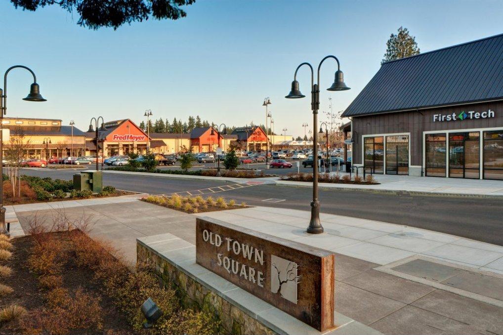 Retail shopping center with "Old Town Square" sign in front