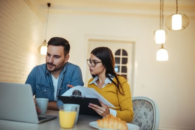 young couple at laptop_GettyImages-862600138