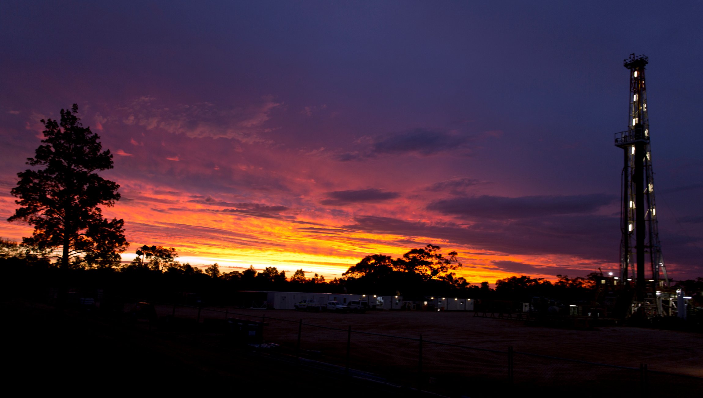 A drilling rig at dusk.