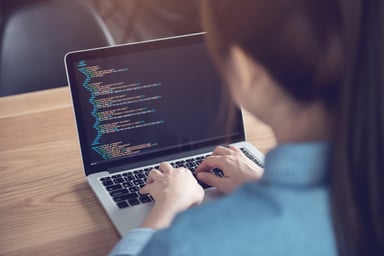 Woman Coding on Laptop APPN