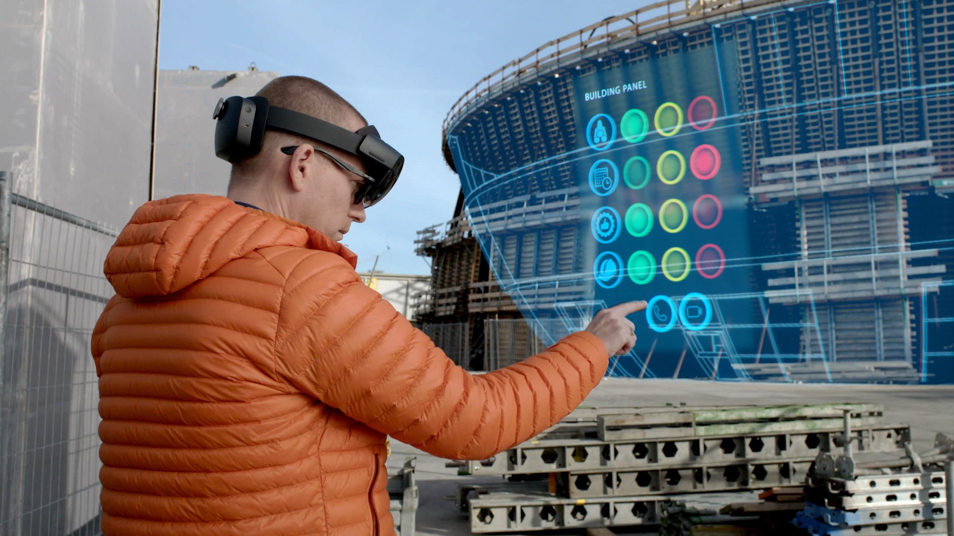 A man uses a Microsoft HoloLens. 
