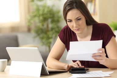 woman looking at document_GettyImages-833135726