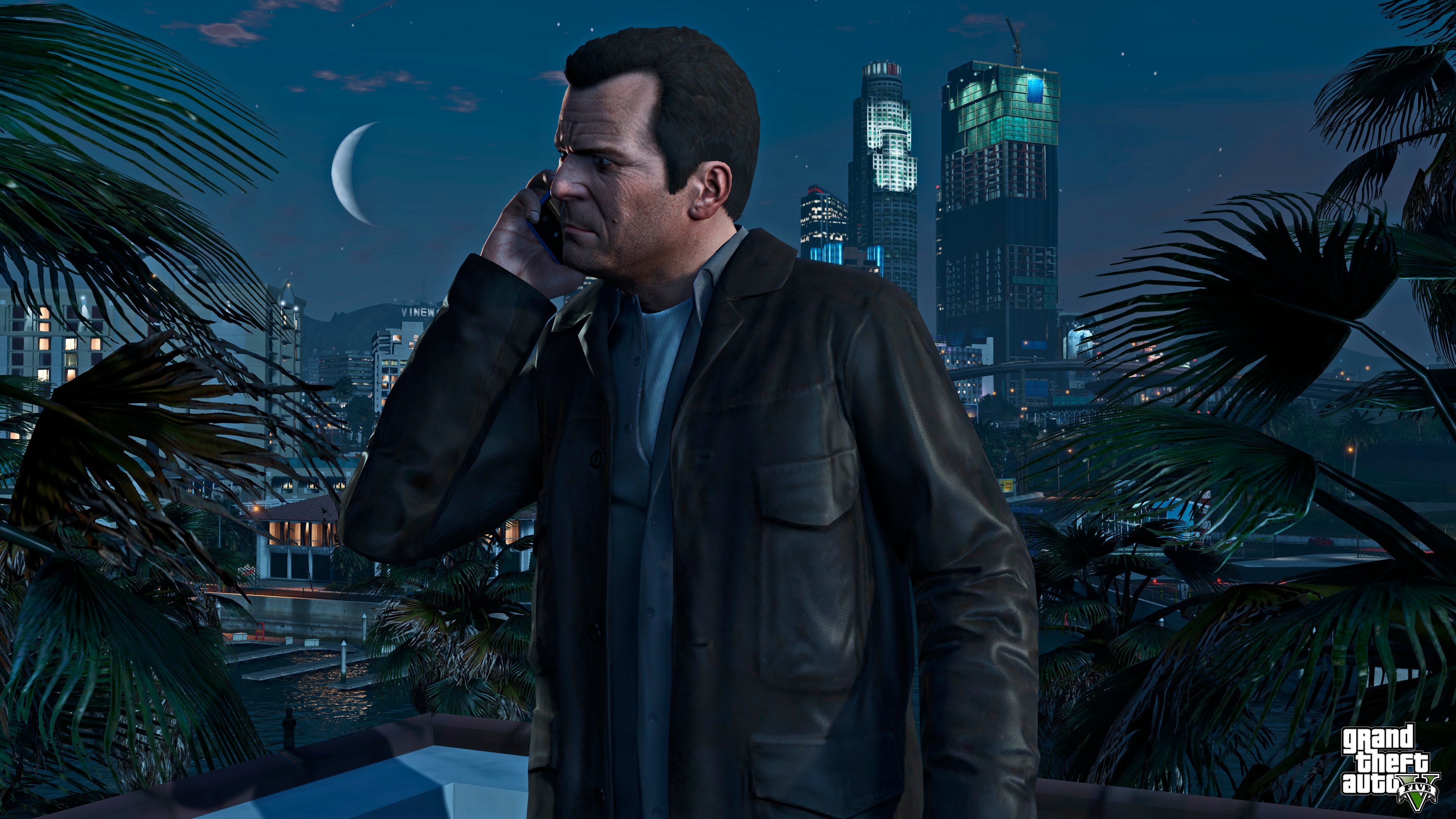 A character in Grand Theft Auto 5 on the phone with buildings in the background.