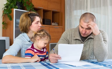stressed parents with child_GettyImages-515148868