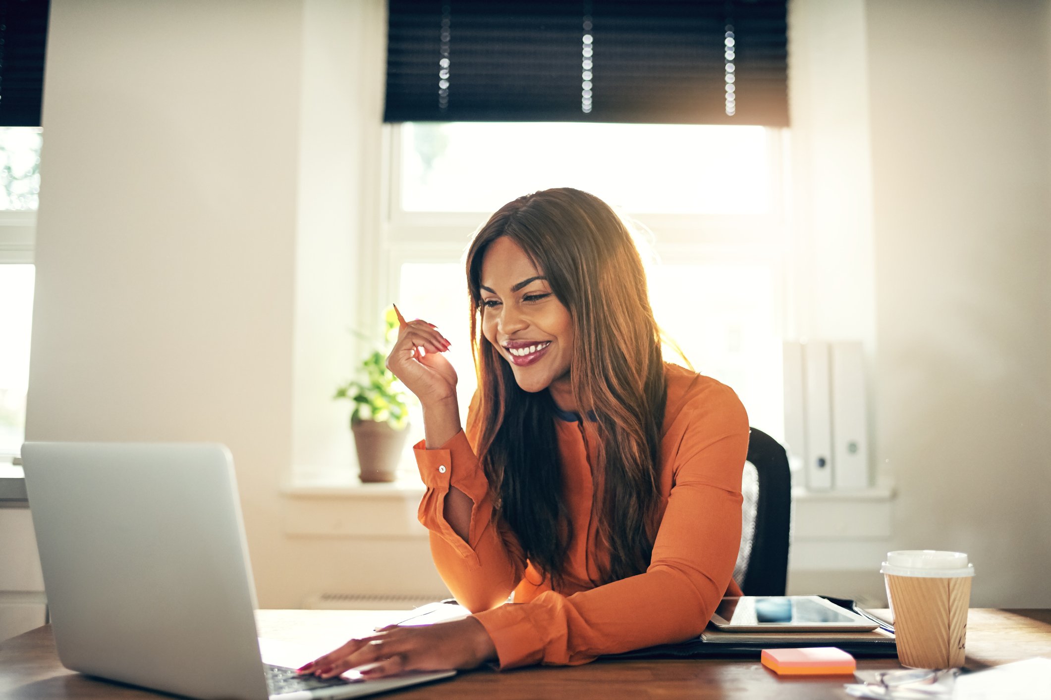 Smiling woman at laptop