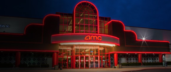 AMC theater location with awning outlined in red lights.