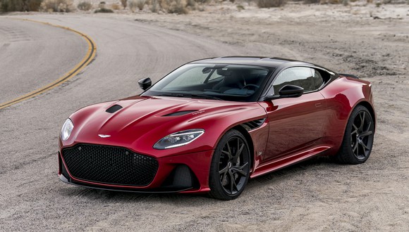 A red Aston Martin DBS Superleggera, a sleek high-performance supercar. 