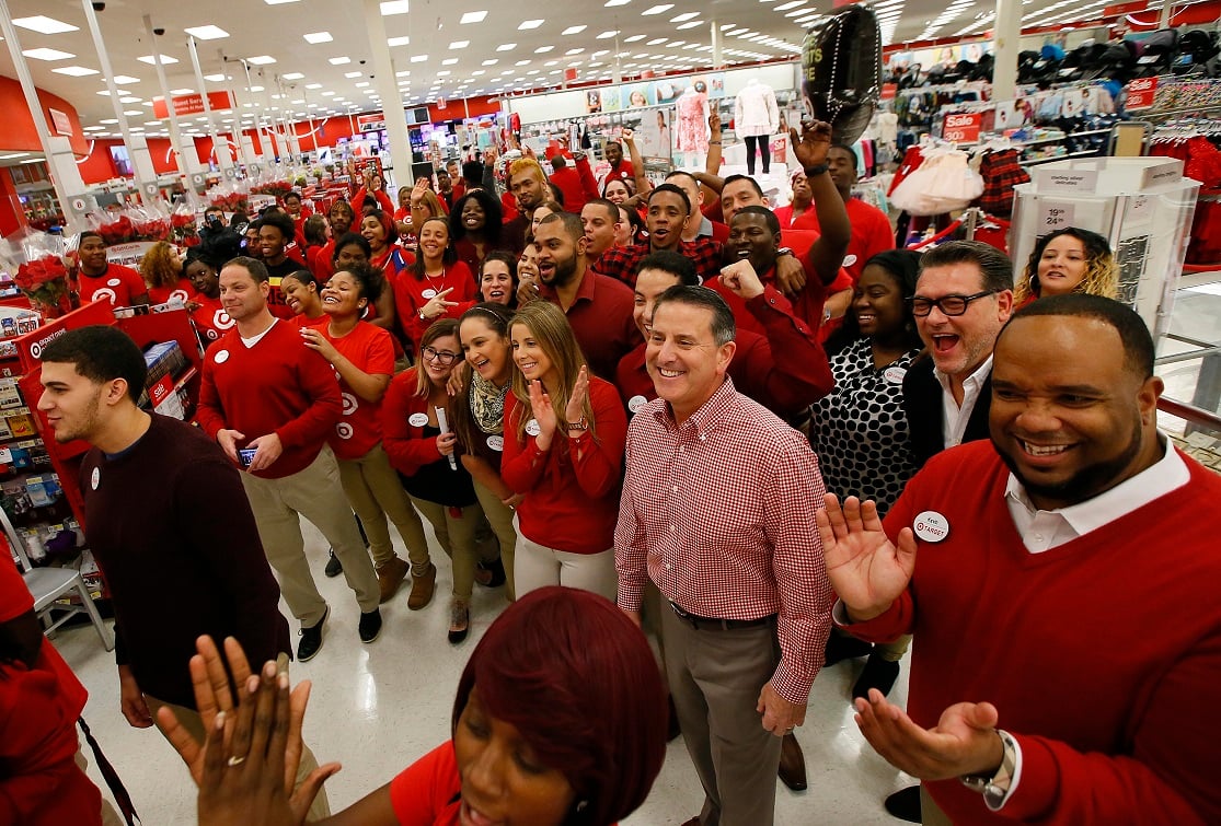 Dozens of workers at a Target store wearing uniforms.