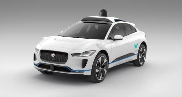 A Jaguar I-Pace car with Waymo branding.