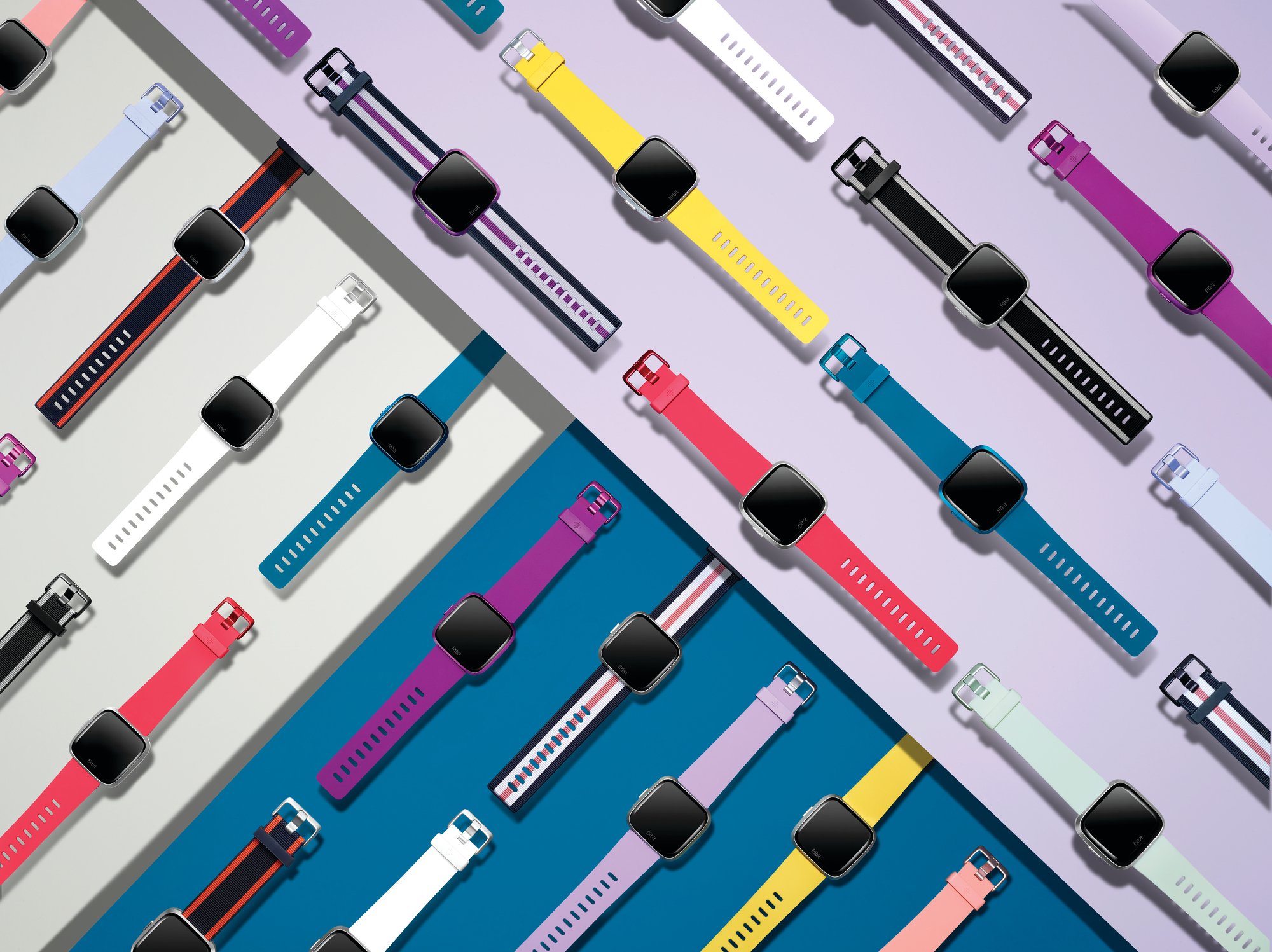 Fitbit Versa Lite Edition devices in various colors