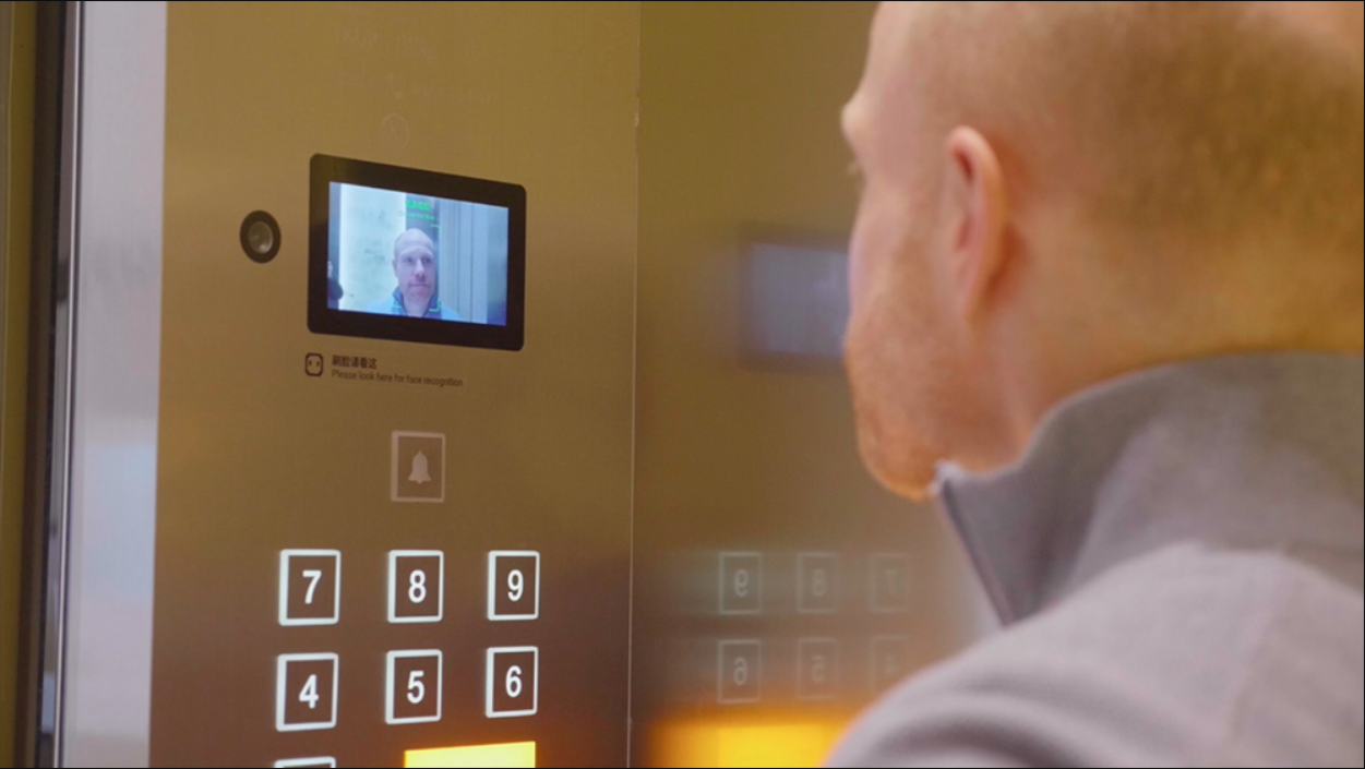 Alibaba's new futuristic hotel, FlyZoo, shows facial recognition software being used to operate an elevator.