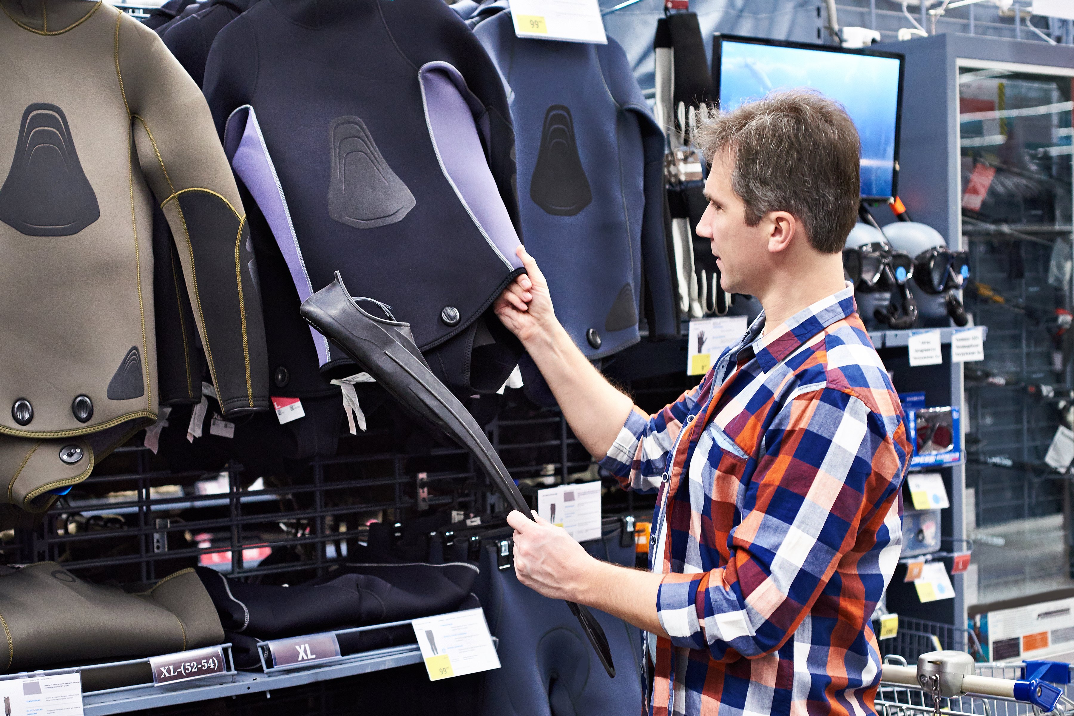 A man shops for sporting goods.