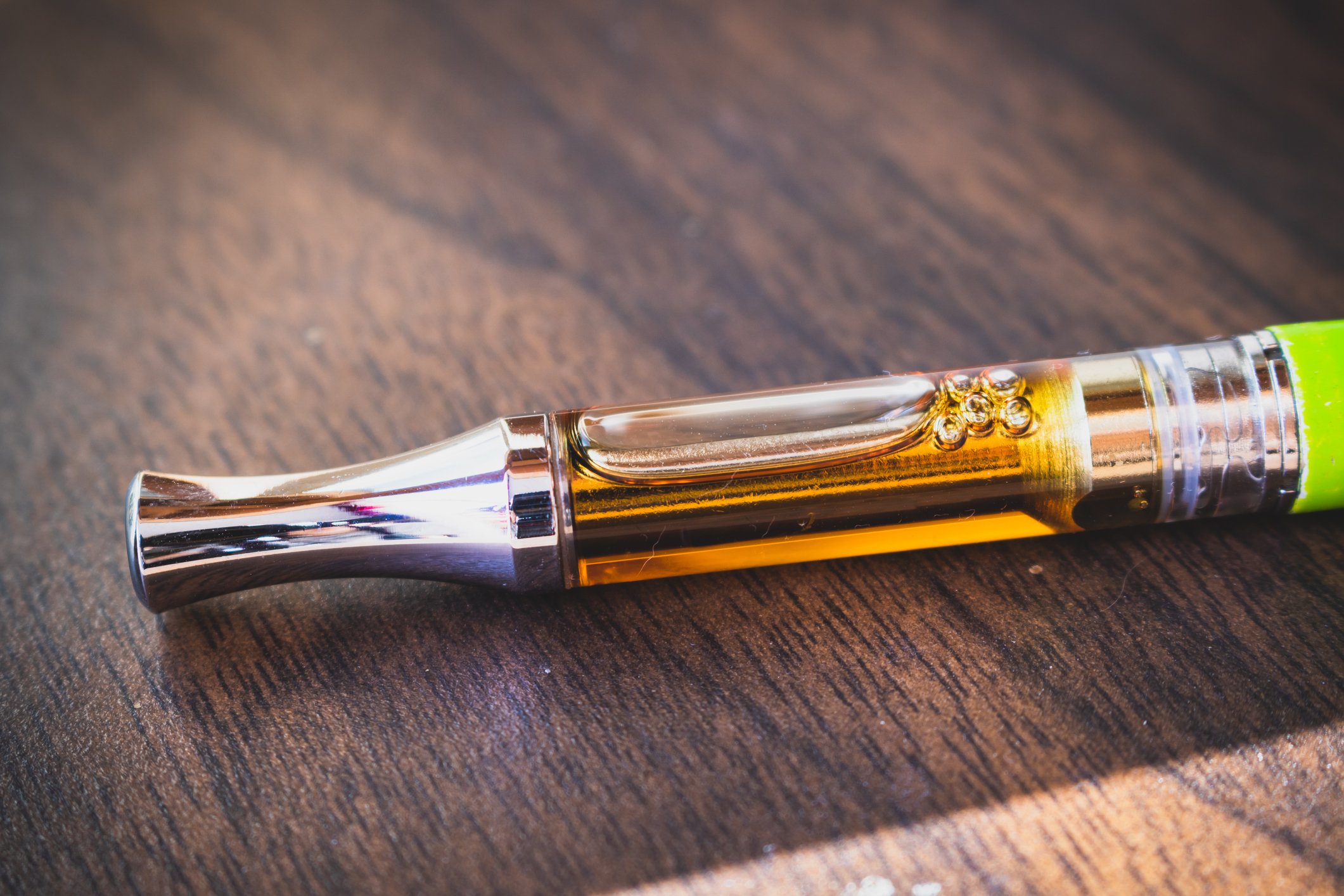 Vape cartridge on a table.
