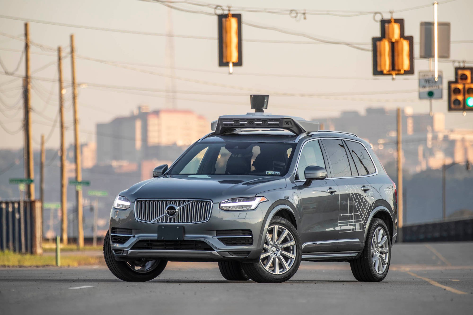 A Volvo SUV with Uber's autonomous vehicle technology on it.