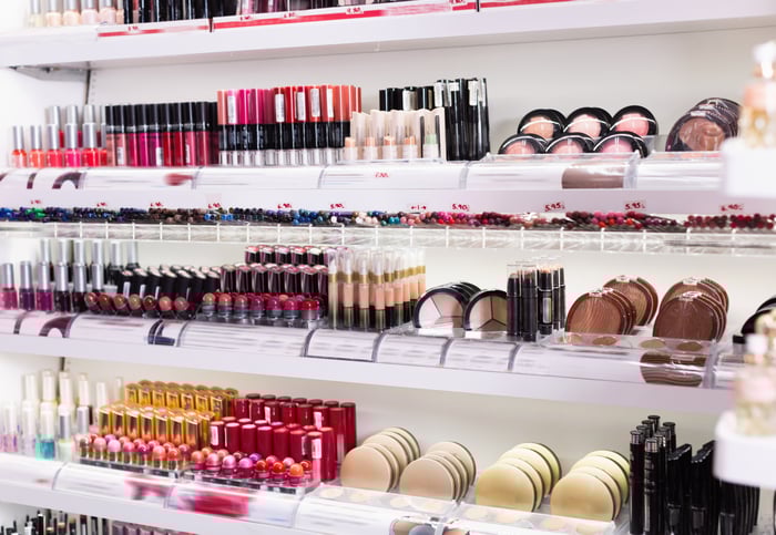 Makeup display with lipstick and accessories.