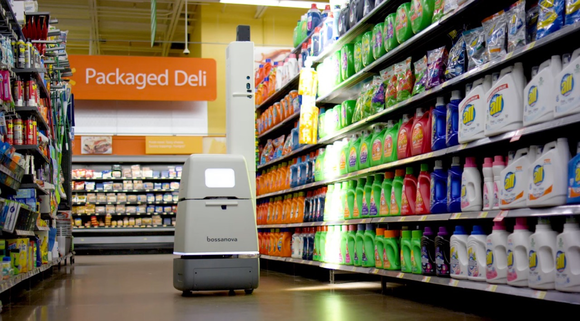 A self-driving robot scanning store shelves at Walmart.