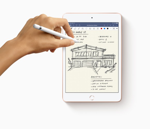 A person drawing and writing with an Apple Pencil on a new iPad mini