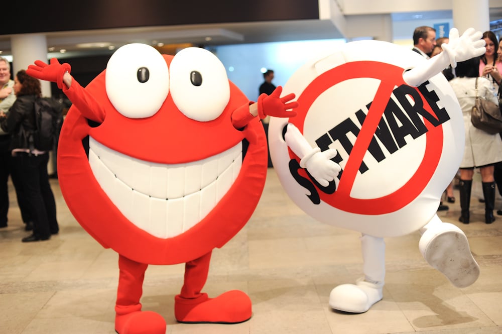 Salesforce mascots Chatty and SaaSy posing for a picture together at a conference