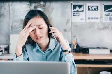 stressed woman at desk_GettyImages-868495520