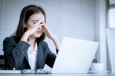 stressed woman at laptop_GettyImages-1016737662