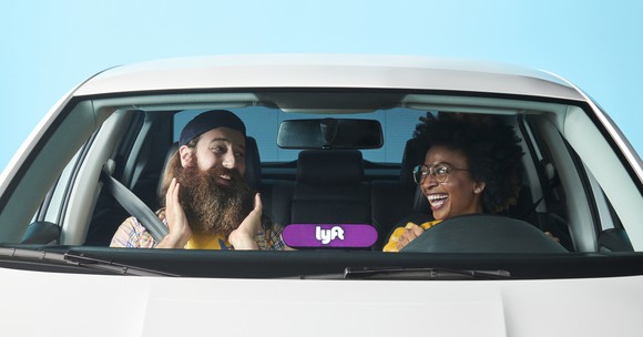 Driver and passenger in a Lyft car.