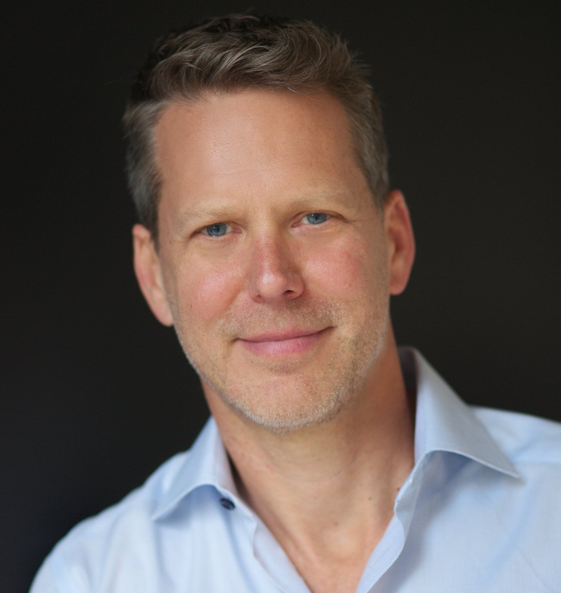 A headshot of Tim Stone. 