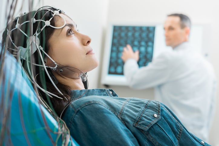A woman getting an EEG.