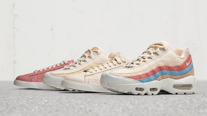 Four Nike Air Max shoes in pastel colors.