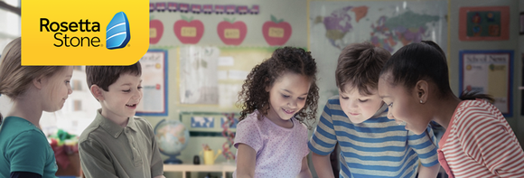 Children in a classroom, with the Rosetta Stone logo in the upper-left corner.