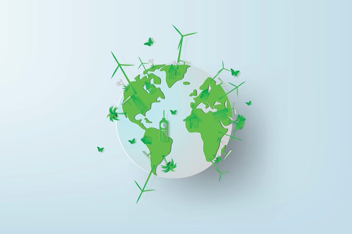 A green globe with wind turbines and butterflies.